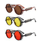 Three pairs of steampunk-style sunglasses with different colored lenses on a white background.